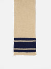 Close-up of a Sand Chunky Knit Stripe Lenny Scarf on a white background. The scarf is cream with navy blue stripes near the bottom.