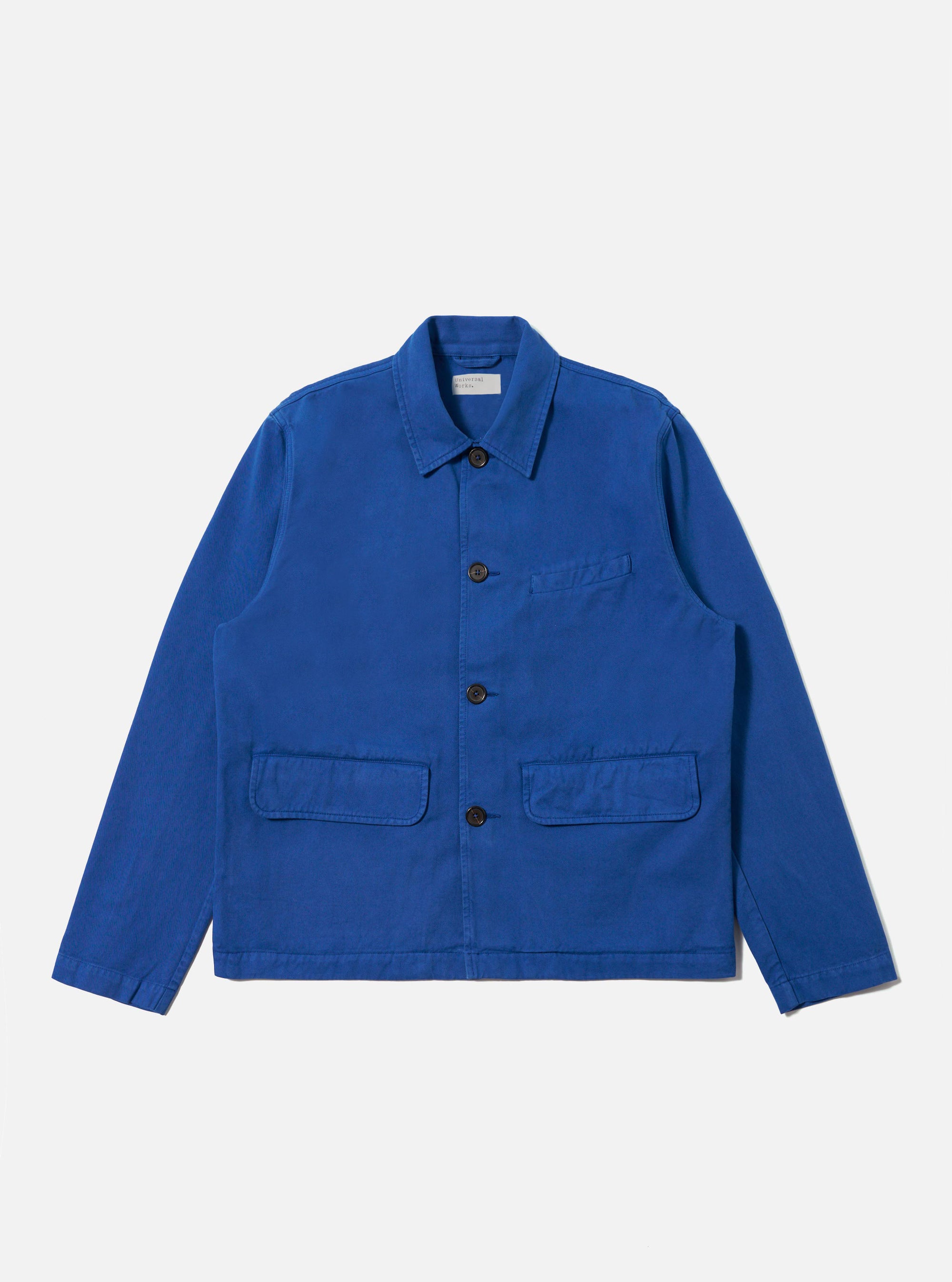 The Navy Derek Twill Warmus Jacket in bright blue twill. Button-up, with patch pockets. Shot on a clean white background.