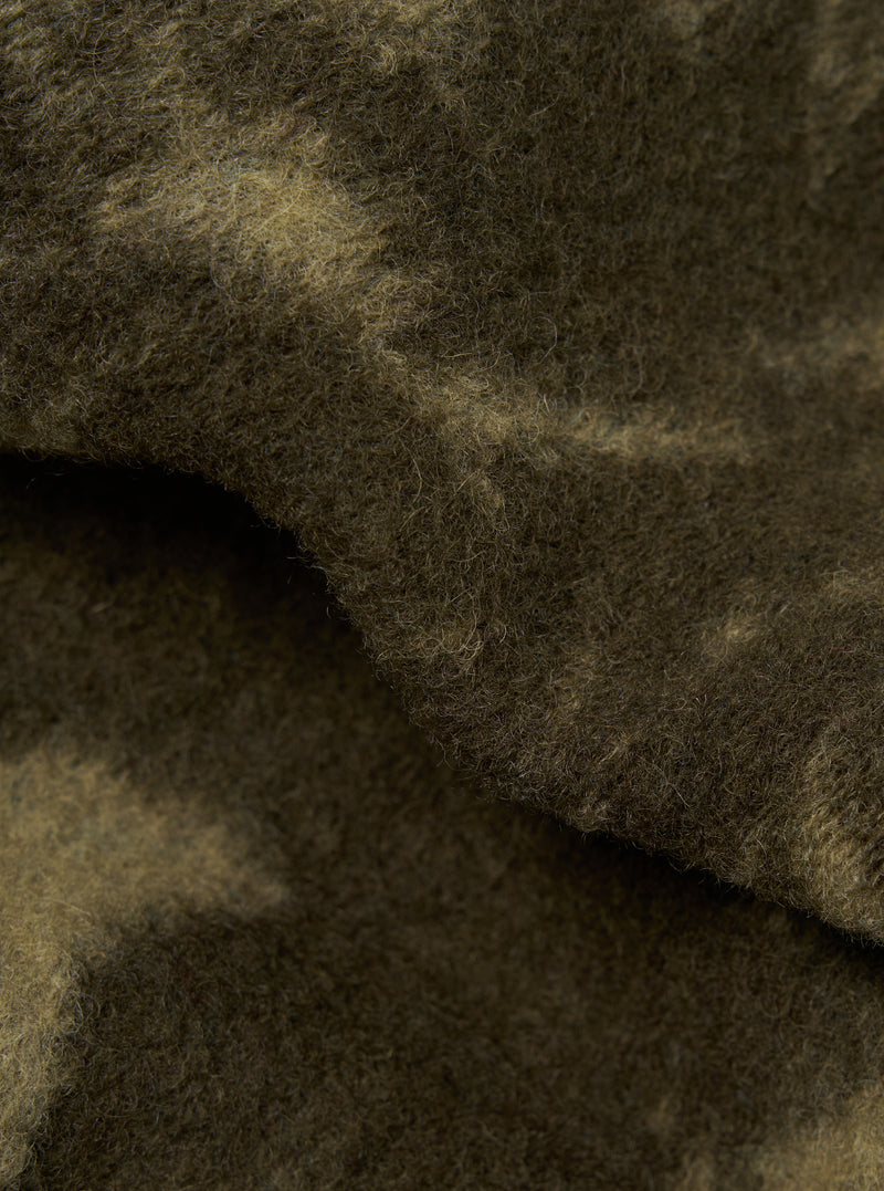 Close-up of the Green/Pale Green Studio Fleece Cardigan, showing the texture and color variations of the soft fleece material.