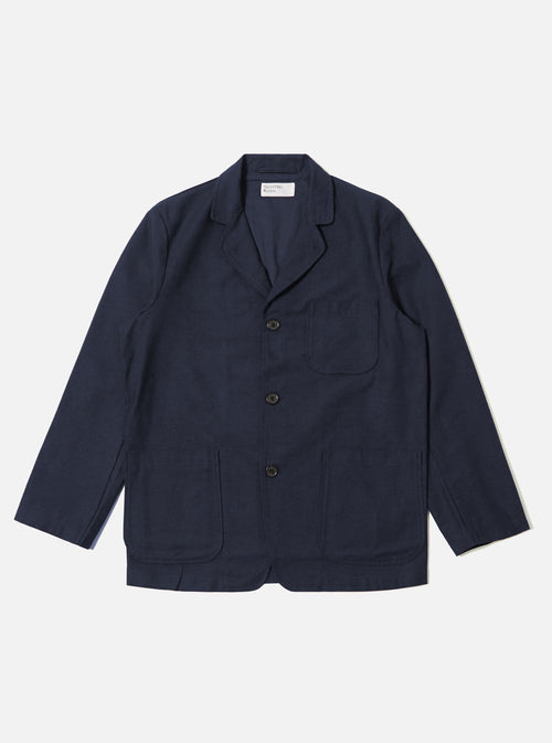 The Navy Lucca Suiting Three Button Jacket in navy is laid flat on a white background. The jacket has three buttons and patch pockets.