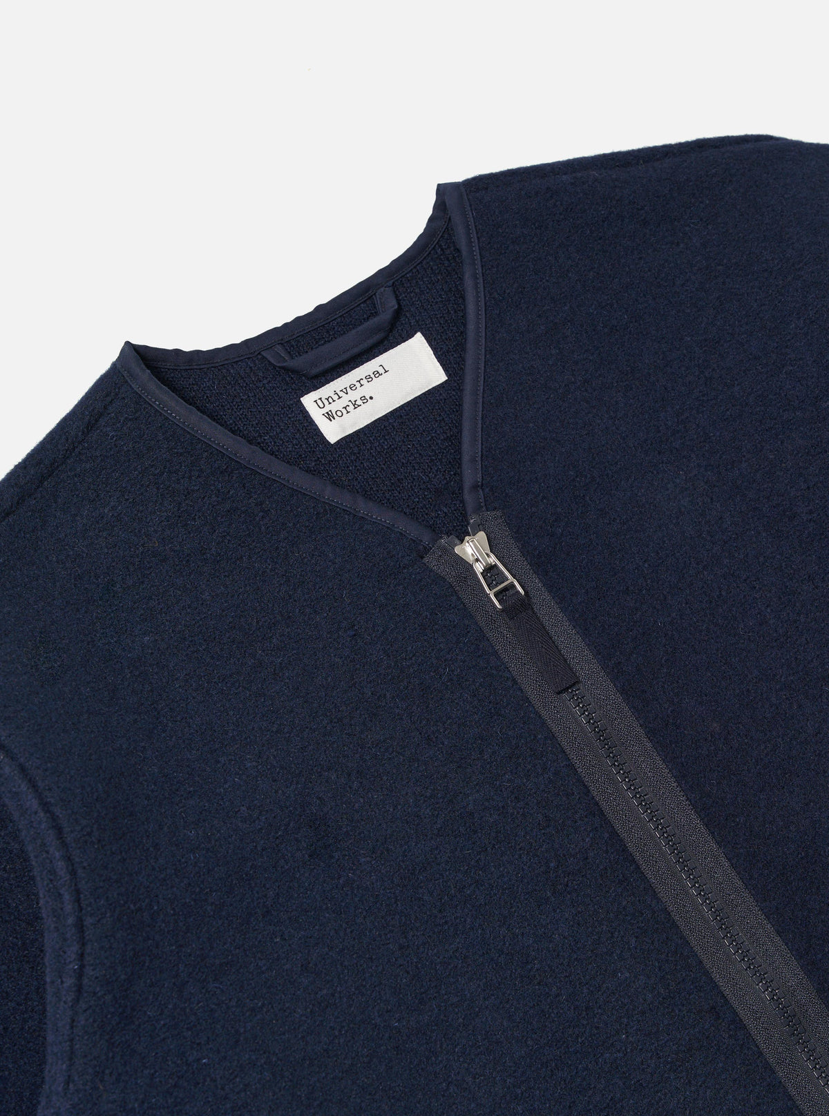 Close-up of the Navy Techno Melton Plain Zip Liner Jacket on a white background. The jacket is made of a textured navy material with a full zip.