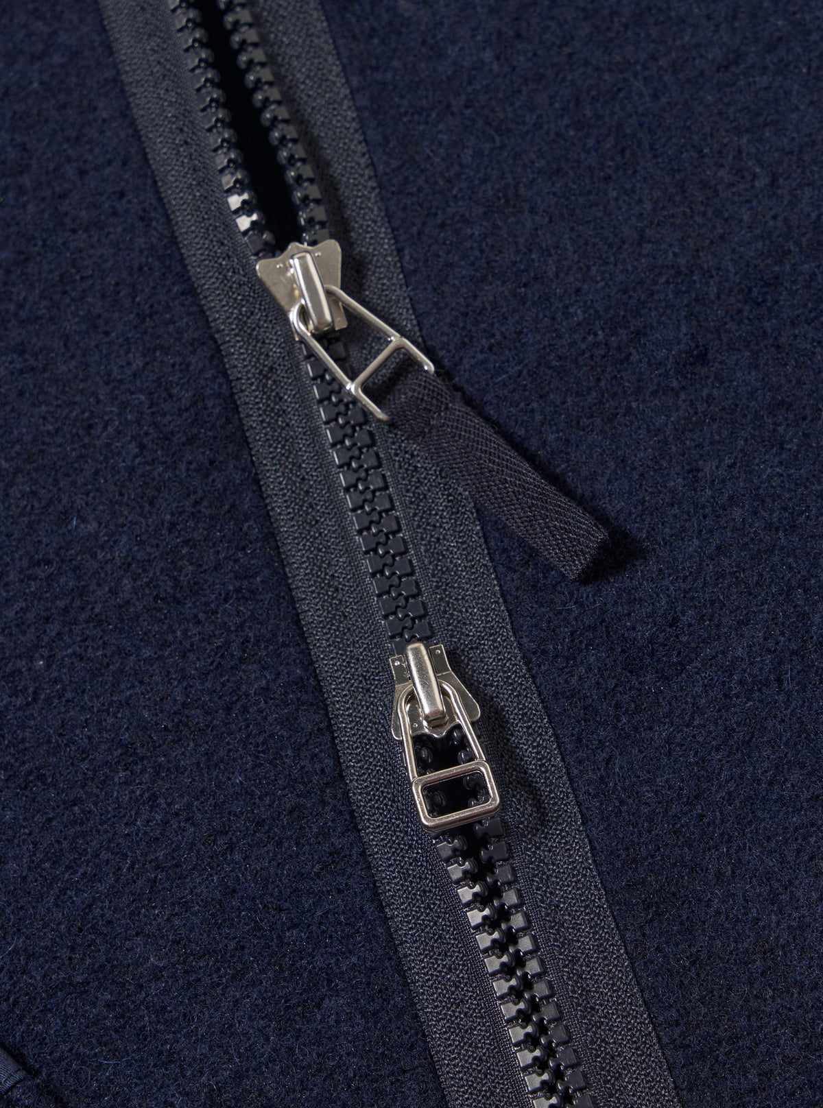 Close-up of the Navy Techno Melton Plain Zip Liner Jacket showing the zipper detail and melton fabric texture.