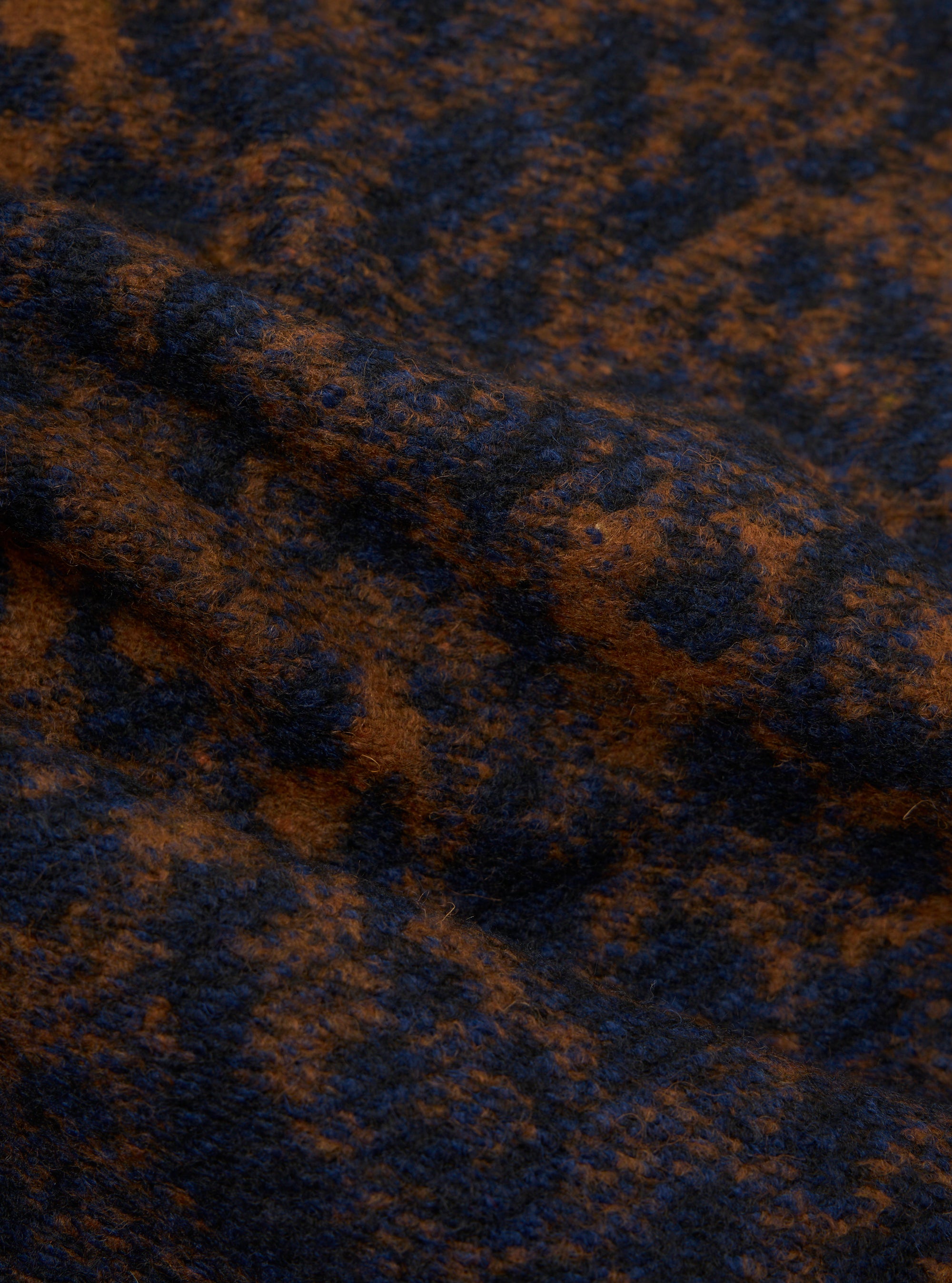Close-up of the Dark Navy/Brown Night Leopard Zip Waistcoat fabric. The material is a textured knit in a dark navy and brown leopard print pattern.