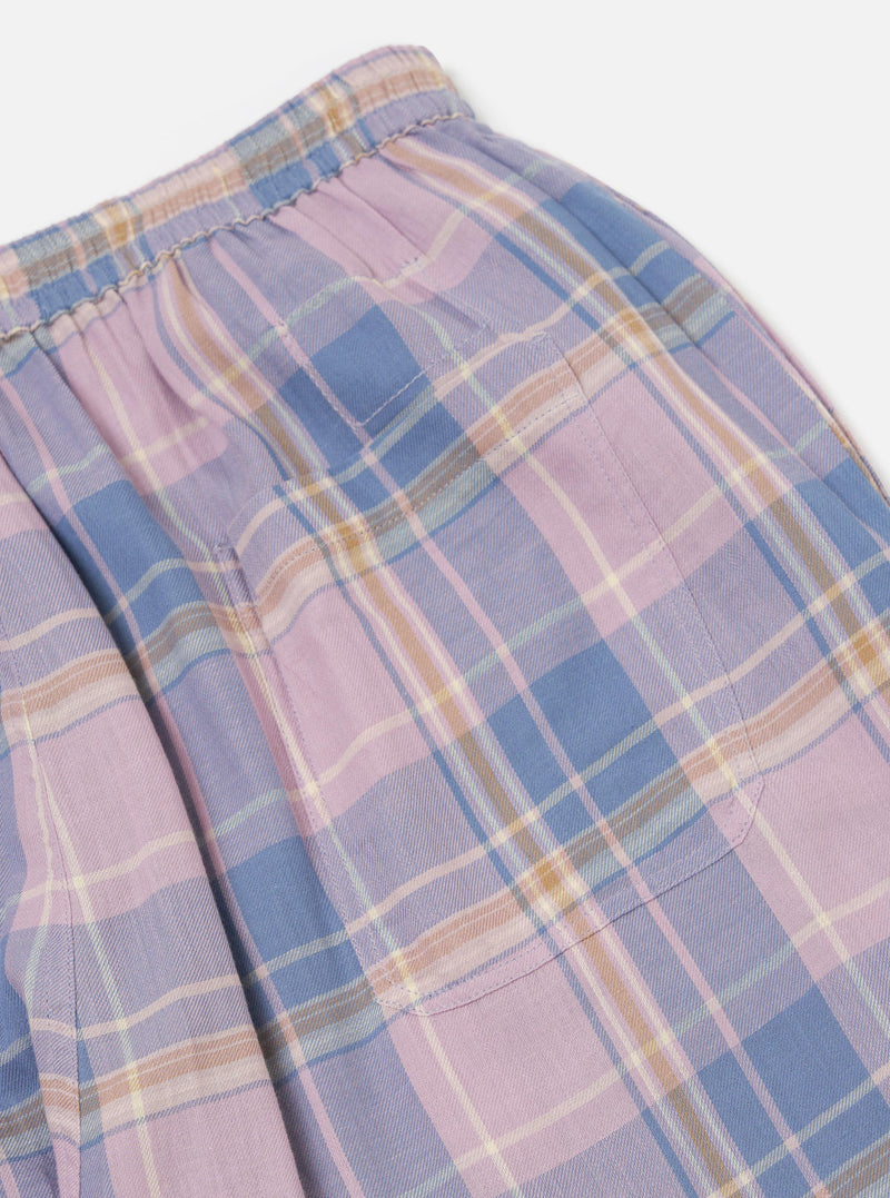 Close-up of the Pink/Blue Pastel Plaid Pyjama Pant, showcasing the elastic waistband and pocket detail. The fabric is soft and cozy, perfect for lounging. Shot on a clean, white background.