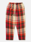 Close-up of the Red Earth Check Long Pyjama Set pants on a white background. The red, orange, cream, and brown plaid pants have an elastic waist and a back pocket.