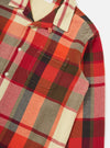 Close-up of the Red Earth Check Long Pyjama Set top. Features a red, orange, and cream plaid pattern on a soft fabric. Shot on a white background.