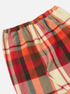 Close-up of the Red Earth Check Long Pyjama Set. Features a red, orange, and cream plaid pattern. Elastic waistband. Shot on a white background.