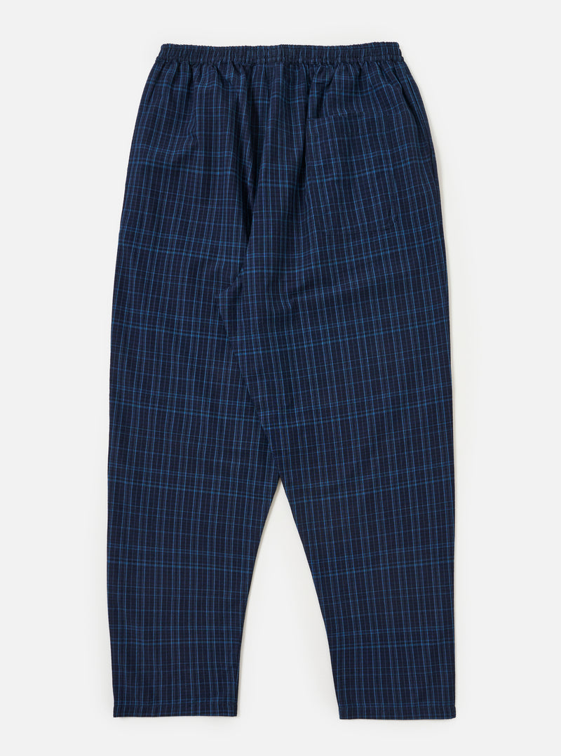 The Indigo Plaid Long Pyjama Set pants laid flat on a white background. The pants are a blue plaid pattern with an elastic waistband.