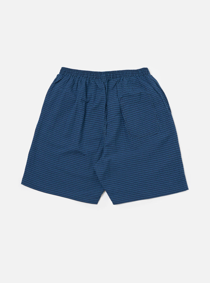 The Blue Gingham Seersucker Pyjama Short, in blue check, on a white background. The shorts have an elasticated waist.