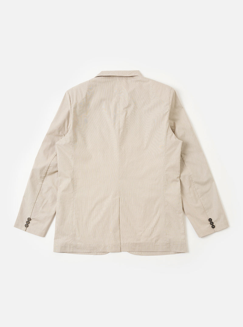 The Brown Kennedy Stripe Boston Blazer is shown from the back as a flat lay against a plain white background. The blazer features a clean, structured back with vertical seams and a straight hem. The cotton fabric displays a distinct brown and cream vertical Kennedy stripe pattern throughout.