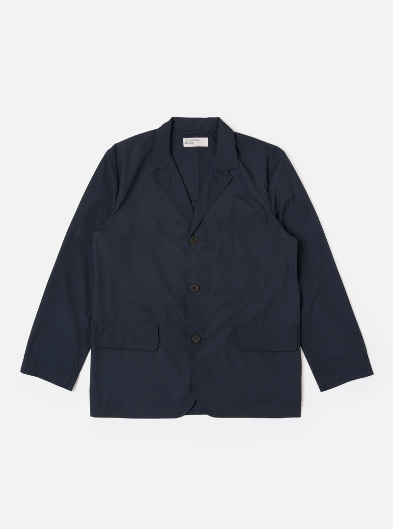 The Navy Recycled Polytech Capitol Jacket is shown as a flat lay against a plain white background. The jacket features a notched lapel, a three-button front closure, a single chest pocket, and two large patch pockets at the waist. The fabric is a deep navy blue with a smooth finish.