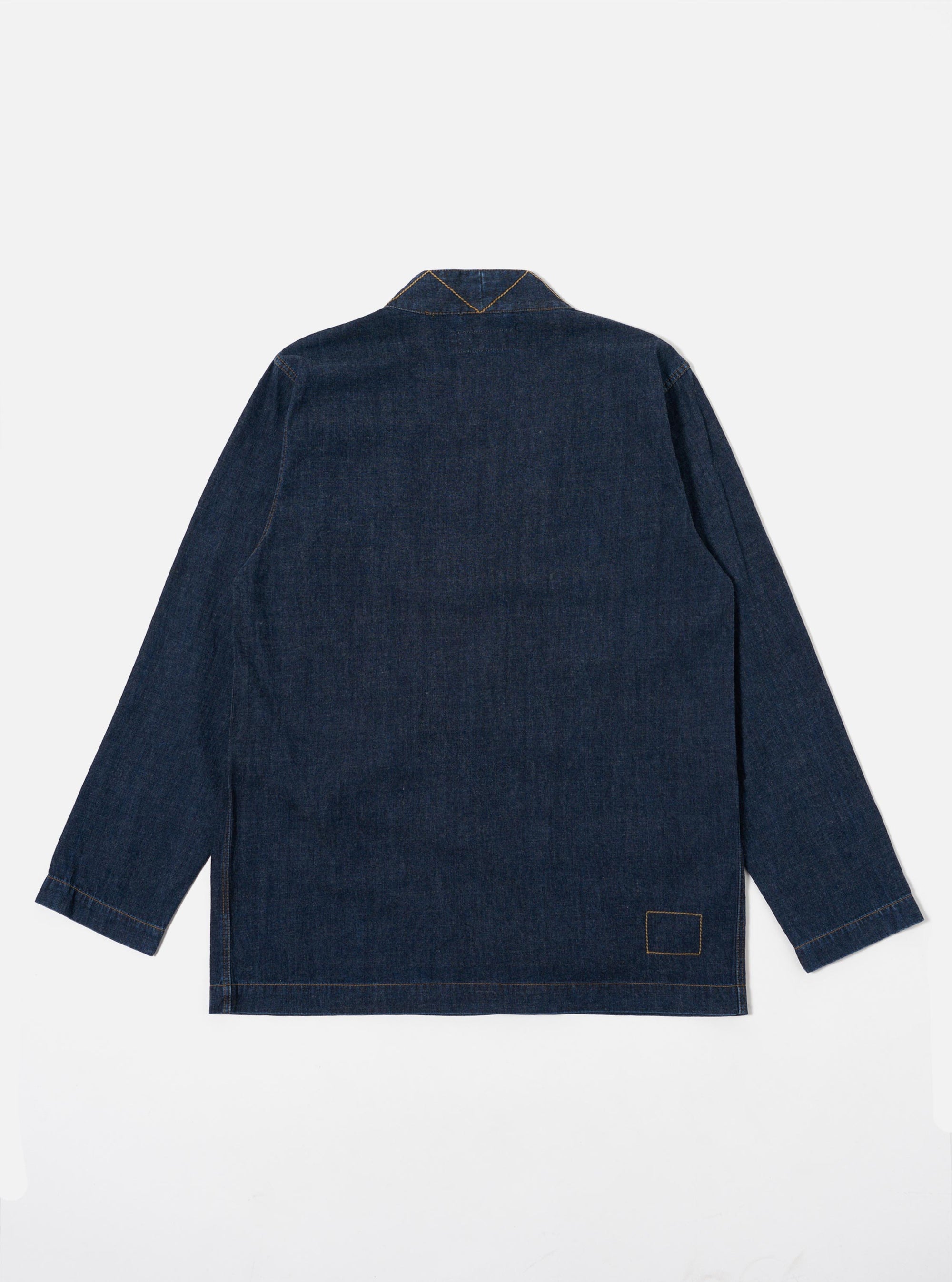 The Indigo Kaihara LT WT Denim Kyoto Work Jacket is shown from the back as a flat lay against a white background. The image highlights the clean, straight-cut hem and the unstructured design of the lightweight indigo denim fabric.