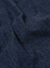 A close-up swatch of the Indigo Kaihara LT WT Denim Kyoto Work Jacket highlights the deep indigo blue color and the fine, diagonal twill weave of the lightweight denim fabric. The texture is consistent throughout the frame, showing no other garment features or models.