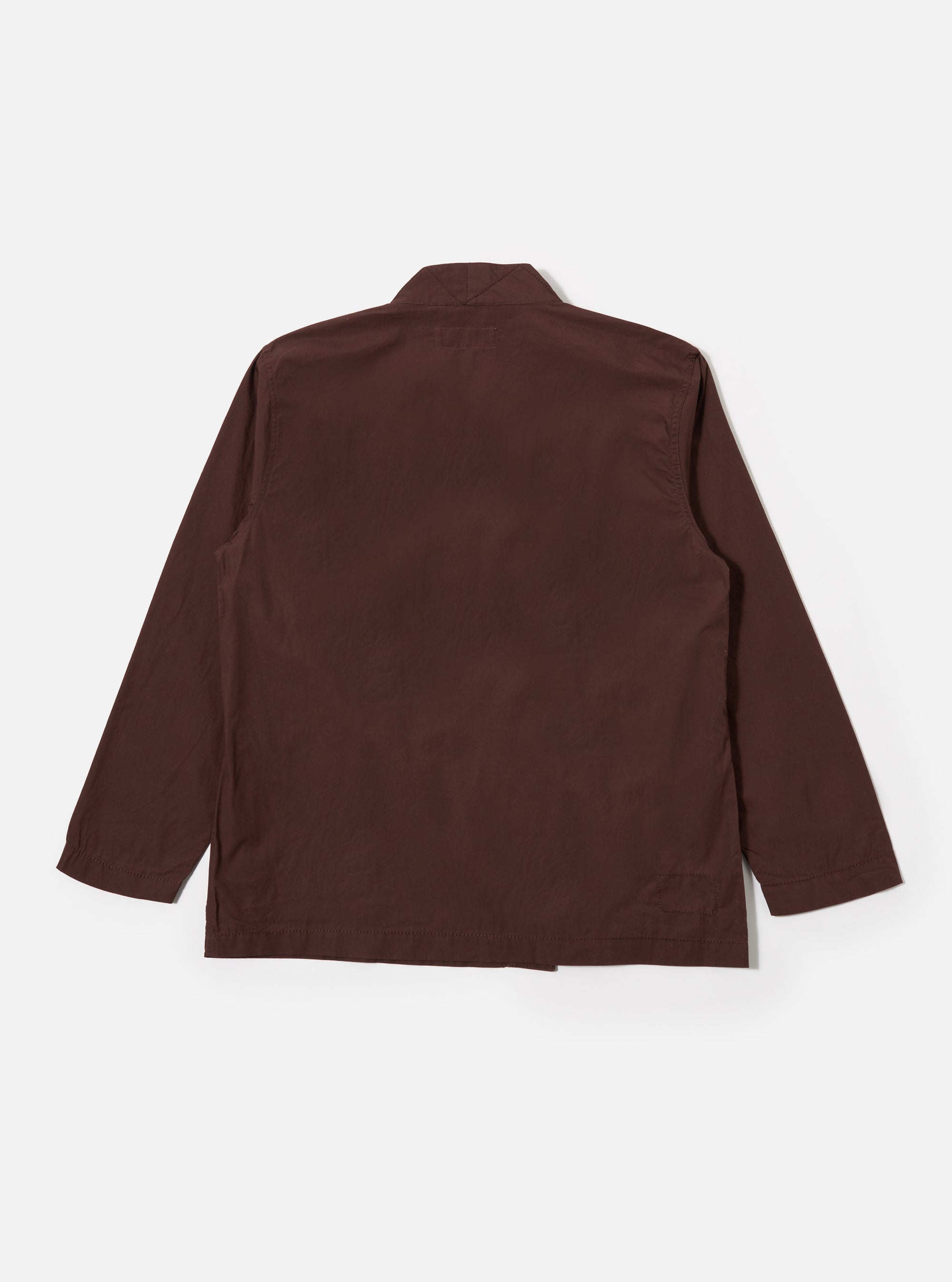 The Brown Peached Poplin Osaka Work Jacket is shown from the back as a flat lay against a plain white background. The image highlights the clean, straight-cut rear panel and the soft, matte texture of the brown peached poplin fabric.