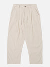 The Brown Kennedy Stripe Duke Pant is shown as a flat lay against a plain white background. These trousers feature a loose, wide-leg fit with a brown and white vertical stripe pattern throughout. The design includes a button waist closure, belt loops, and two large front patch pockets.