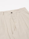 The Brown Kennedy Stripe Duke Pant is shown in a detail view as a flat lay against a plain white background. The image focuses on the construction of the waistband and the fly area, highlighting the brown and white vertical stripe pattern of the cotton fabric. Two side pockets and the pleat detail at the waist are visible.