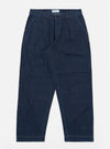 The Indigo Kaihara LT WT Denim Duke Pant is displayed as a flat lay against a plain white background. The trousers feature a wide-leg cut with a slight taper, a single pleat at the front, and a button fly. Two front hand pockets are visible, and the indigo blue denim fabric has a uniform, dark finish.