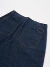 The Indigo Kaihara LT WT Denim Duke Pant is shown in a close-up detail shot from the front, focusing on the waist and upper thigh area against a plain white background. The image highlights the single pleat front, the button fly, and the two front hand pockets, as well as the dark indigo color and smooth texture of the lightweight denim.