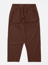 The Brown Peached Poplin Dutch Pant is shown from the rear in a flat lay against a white background. The image highlights the two square rear patch pockets and the loose, wide-leg construction of the brown cotton trousers.