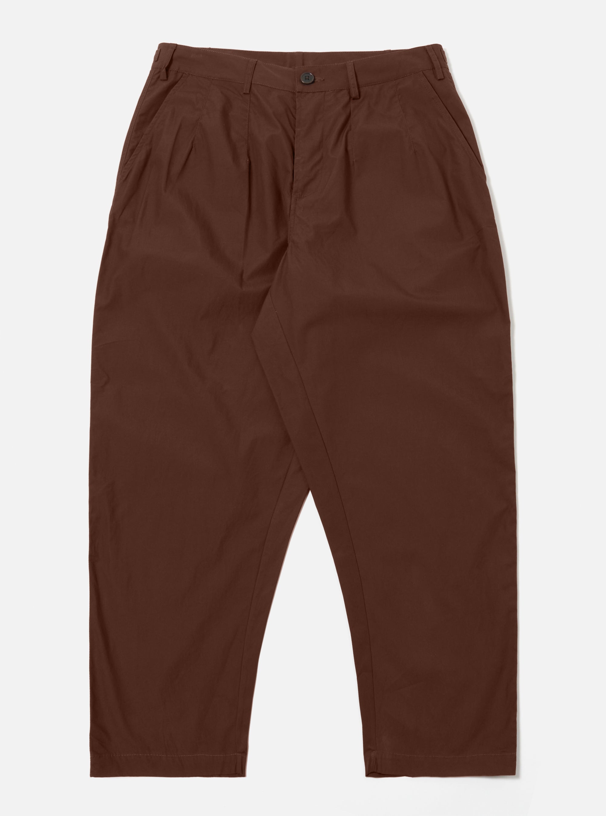 The Brown Peached Poplin Dutch Pant is shown as a flat lay against a white background. The trousers feature a wide, voluminous leg, a button fly, and two large front pockets. The fabric is a smooth, matte brown cotton poplin.