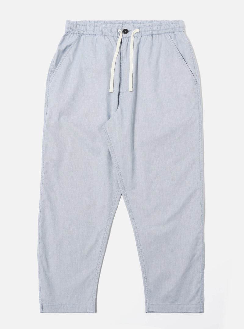 The Navy Kennedy Stripe Hi Water Trouser is displayed as a flat lay against a plain white background. The trousers feature a vertical pinstripe pattern, an elasticated waistband with a drawstring, and two side pockets. The design has a slim, cropped fit with a straight hem.