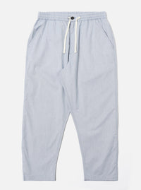The Navy Kennedy Stripe Hi Water Trouser is displayed as a flat lay against a plain white background. The trousers feature a vertical pinstripe pattern, an elasticated waistband with a drawstring, and two side pockets. The design has a slim, cropped fit with a straight hem.