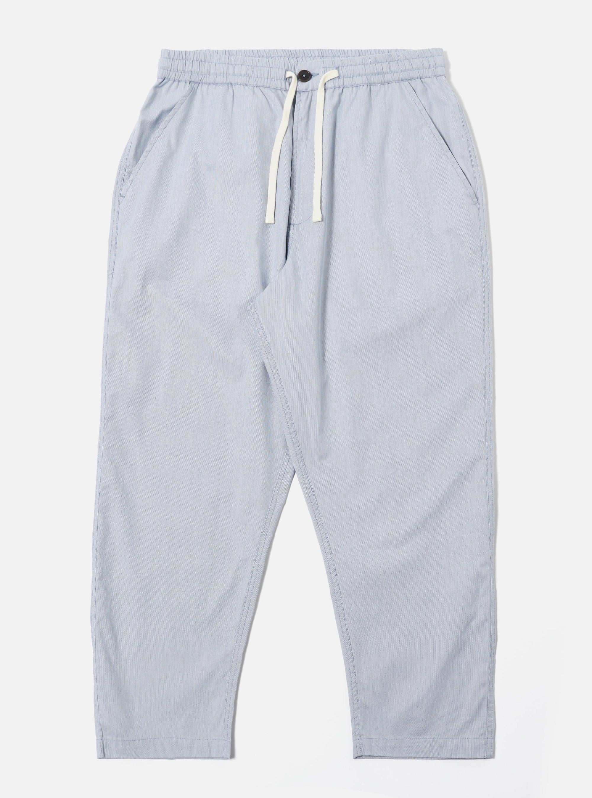 The Navy Kennedy Stripe Hi Water Trouser is displayed as a flat lay against a plain white background. The trousers feature a vertical pinstripe pattern, an elasticated waistband with a drawstring, and two side pockets. The design has a slim, cropped fit with a straight hem.