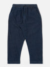The Indigo Kaihara LT WT Denim Hi Water Trouser is shown as a flat lay against a white background. The trousers feature an elasticated waistband with an adjustable drawstring, two slanted side pockets, and a slightly cropped leg. The indigo blue denim fabric has a smooth, lightweight appearance.