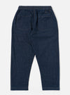 The Indigo Kaihara LT WT Denim Hi Water Trouser is shown from a rear angle as a flat lay against a plain white background. The trousers feature an elasticated waistband and two large rear patch pockets. The lightweight indigo denim fabric shows visible stitching details around the pockets and seams.
