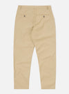 The Sand Recycled Polytech Military Chino is shown from a rear three-quarter angle as a flat lay against a plain white background. The image highlights the two rear jetted pockets with button closures and the tapered leg construction. The light sand-colored fabric has a smooth, technical finish.
