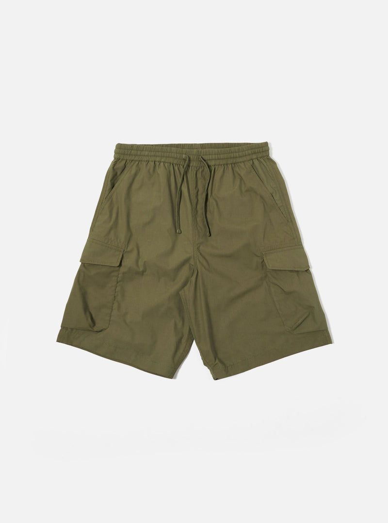 The Olive Recycled Polytech Parachute Short is shown as a flat lay against a plain white background. The shorts feature a relaxed fit, an elasticated waistband with a tonal drawstring, and two large 3D bellows cargo pockets on the sides. The garment is made from a smooth olive green fabric with visible stitching details.
