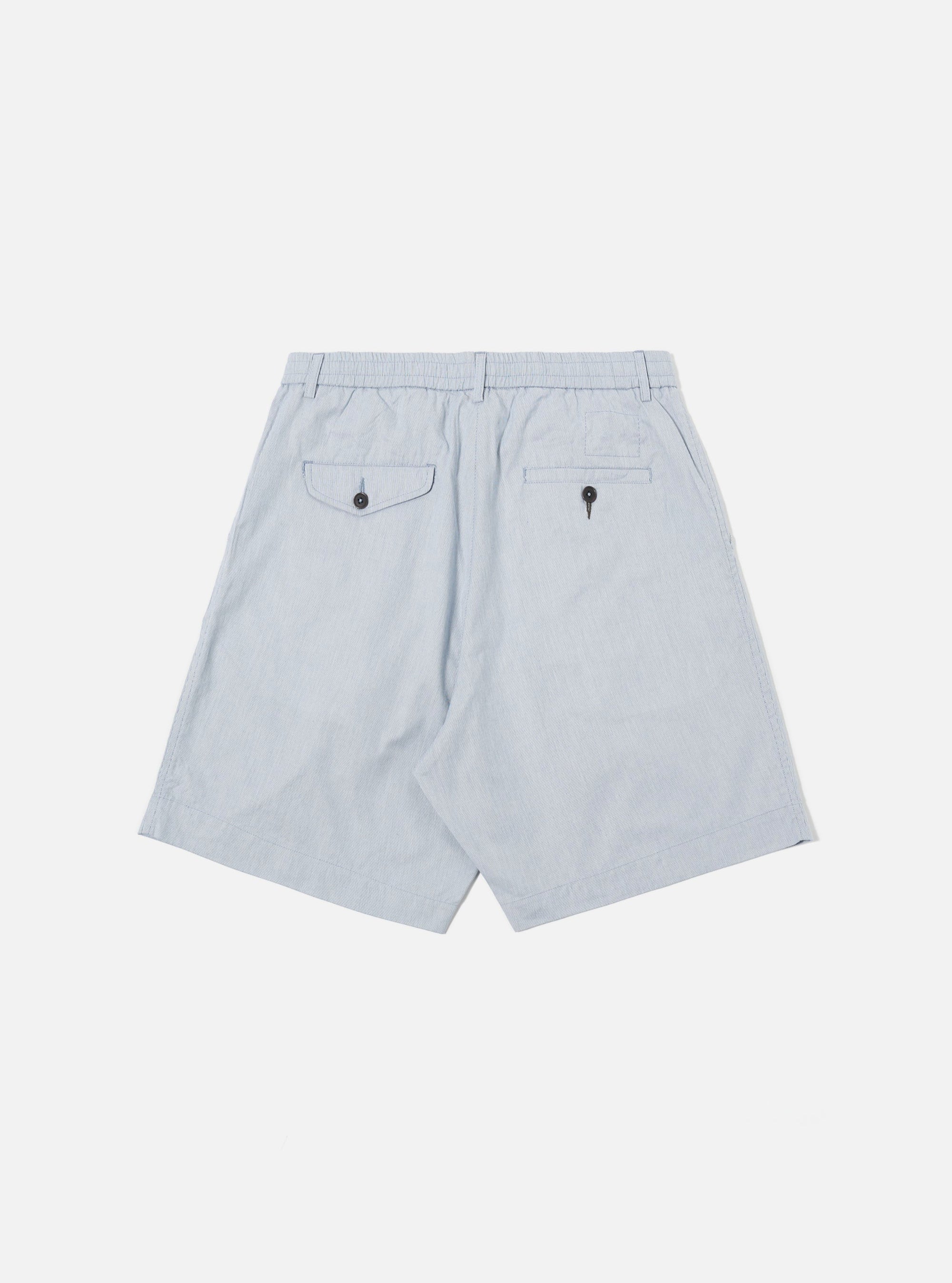 The Navy Kennedy Stripe Pleated Track Short is shown from the back as a flat lay against a plain white background. The shorts feature a navy and white vertical stripe pattern, an elasticated waistband, and a single rear patch pocket on the right side.