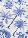 A close-up fabric swatch of the White Jungle Toile Poplin Camp Shirt displays an intricate jungle-themed print featuring animals and tropical foliage in a dark ink against a white cotton poplin background. The image highlights the detailed illustrations and the smooth, lightweight texture of the fabric.