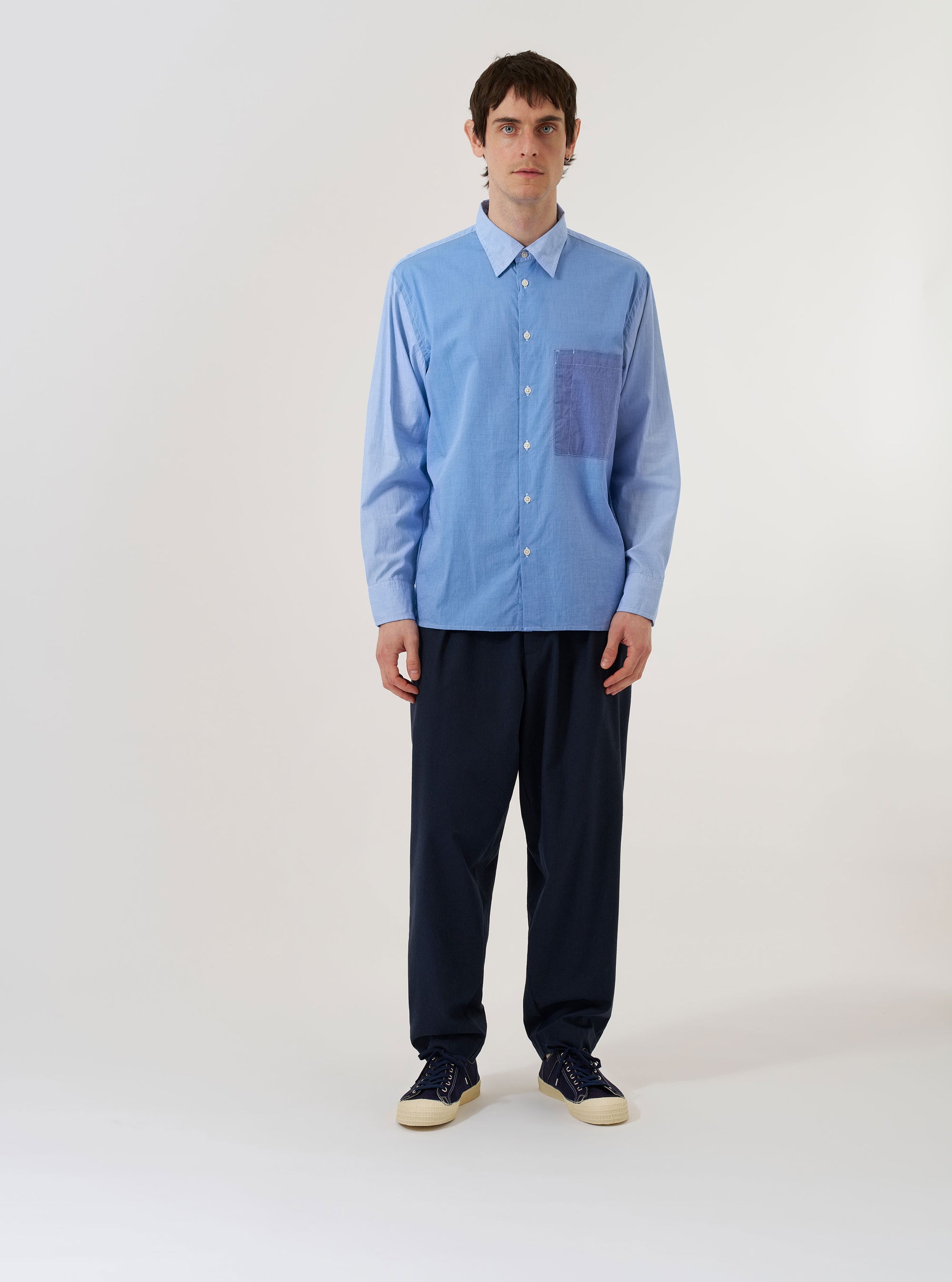The Sky/Blue Fil A Fil Mixed Square Pocket Shirt is shown as a flat lay against a plain white background. The shirt features a classic button-down front, a structured collar, and two distinctive square patch pockets on the chest. The fabric has a fine Fil A Fil weave in a light sky blue color.