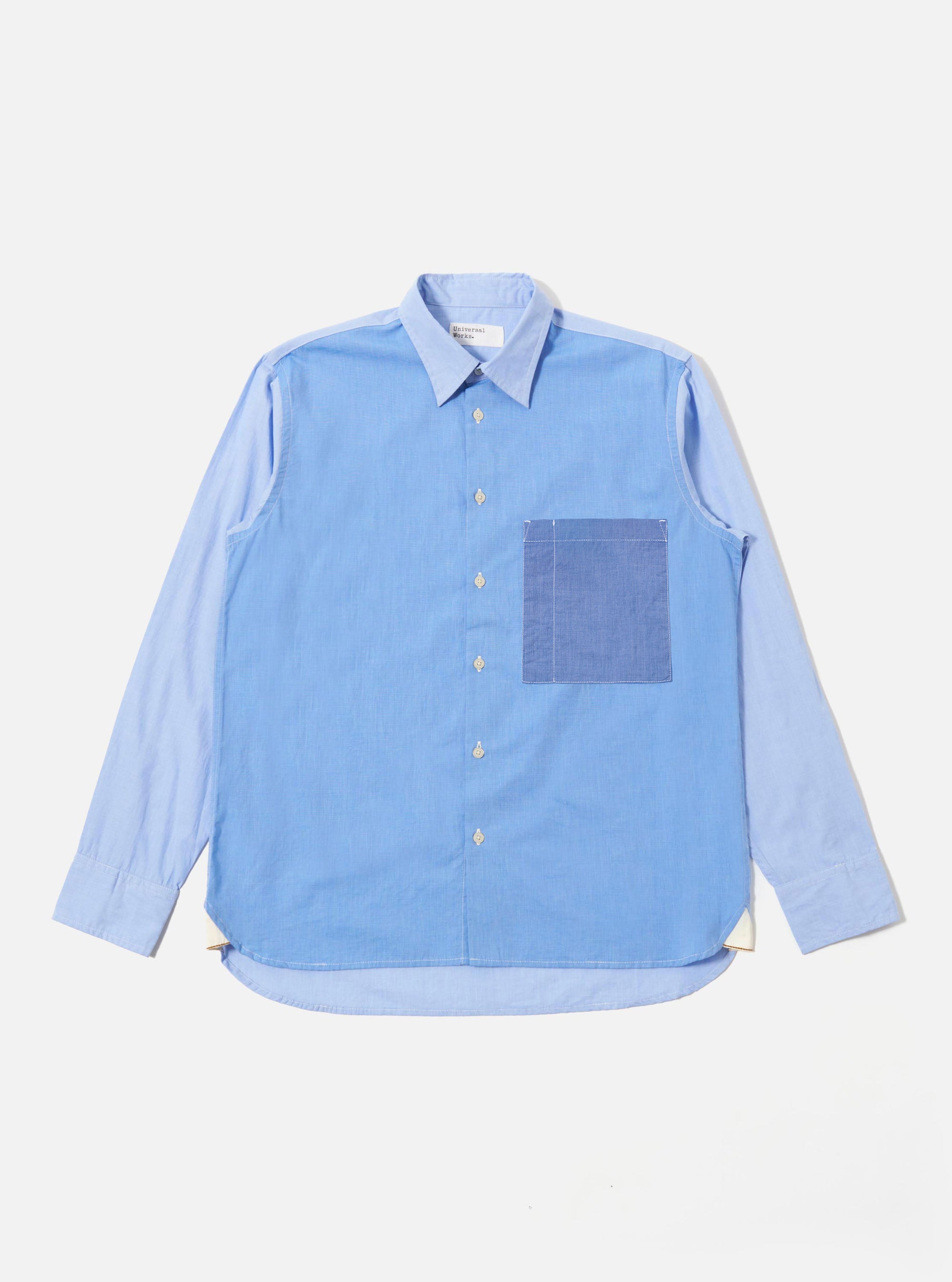 The Sky/Blue Fil A Fil Mixed Square Pocket Shirt is shown as a flat lay against a white background. The shirt features a classic button-down collar, a central button closure, and two prominent square chest pockets. The fabric displays a light blue "fil-a-fil" or end-on-end weave texture.