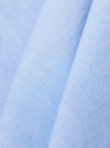 A close-up fabric swatch of the Sky/Blue Fil A Fil Mixed Square Pocket Shirt displays a light blue and white woven texture. The image focuses on the fine, grid-like pattern of the cotton fabric.