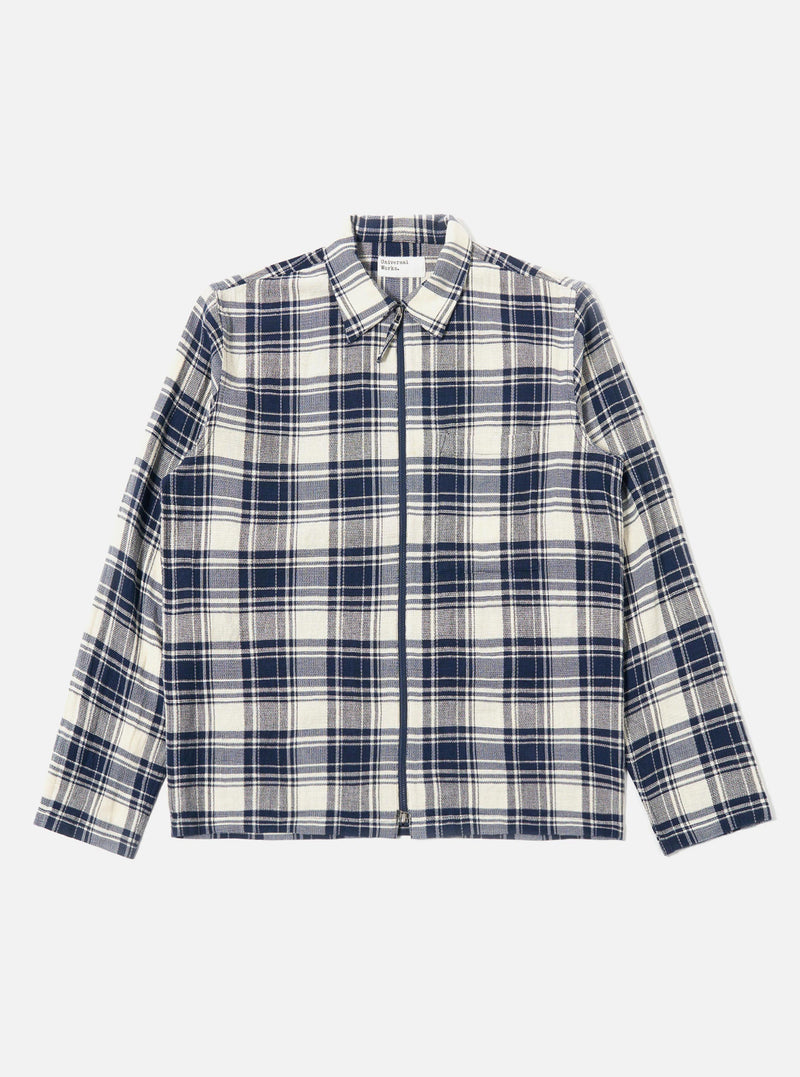 The Navy Texture Plaid Zip Shirt is shown as a flat lay against a plain white background. The shirt features a full-length silver-tone zip closure, a structured pointed collar, and two large patch pockets on the chest. The navy blue fabric displays a distinct textured plaid pattern throughout.