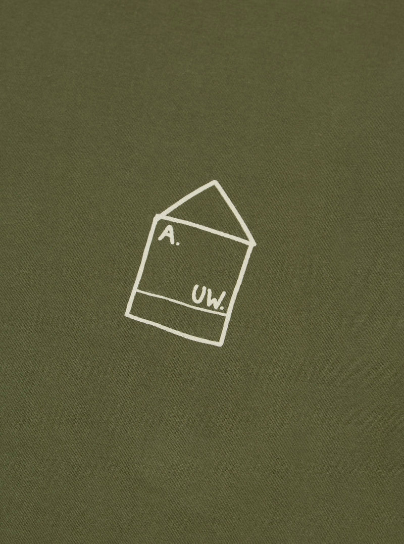 Close-up of the A. SOCIETY x Universal Works Olive Single Jersey Print Tee. The olive tee features a white graphic print. Soft, single jersey material.