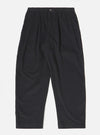The Black Organic Fine Cord Oxford Pant is shown as a flat lay against a white background. The trousers feature a wide leg with a slight taper, a single pleat front, and an elasticated waistband with a drawstring. The garment is made from a black organic fine-wale cotton corduroy.