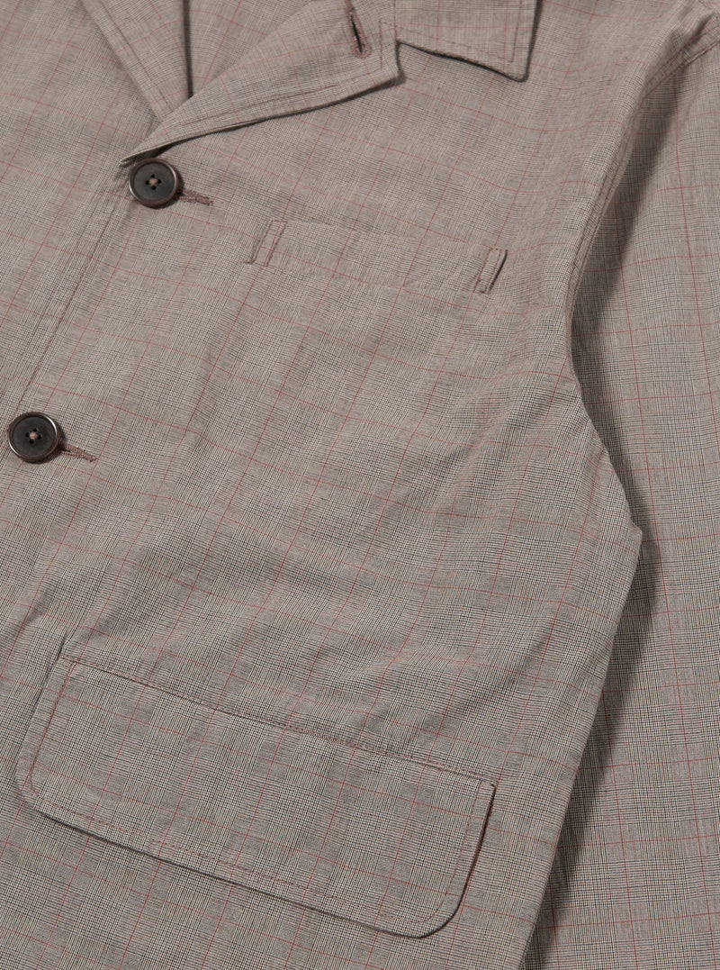 The Grey Brown Wales Glen Check Franck Jacket is shown from the back as a flat lay against a plain white background. The image highlights the straight-cut rear panel and the detailed grey and brown glen check pattern of the cotton fabric.