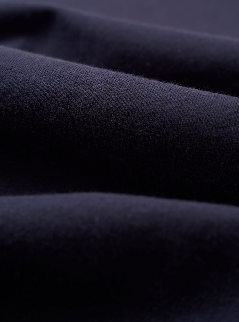 A close-up swatch image of the Navy Recycled/Bio Jersey Henry L/S Tee fabric. The image focuses on the textile detail, showing a deep navy blue color with a soft, uniform jersey knit texture.