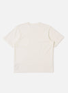 The Antique White Recycled/Bio Jersey Core Pocket Tee is shown from the back as a flat lay against a plain white background. The image highlights the clean, simple construction of the t-shirt, featuring a ribbed crew neckline and a straight hem. The fabric is a solid antique white jersey with a smooth texture.