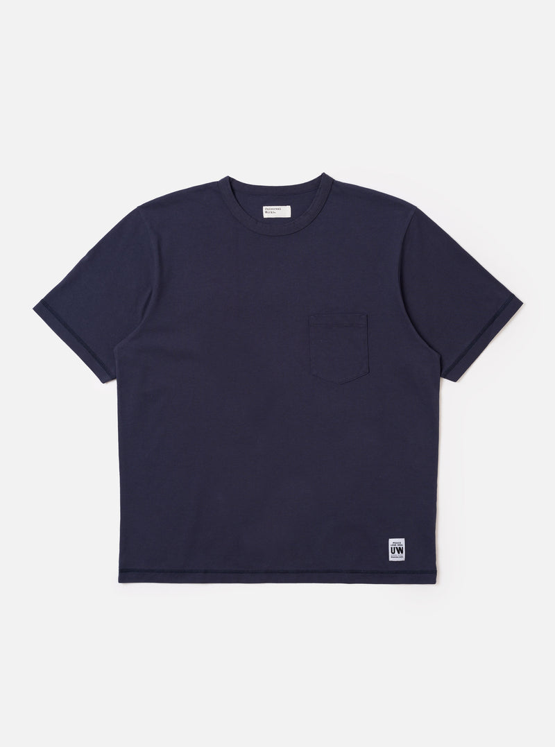The Navy Recycled/Bio Jersey Core Pocket Tee is shown as a flat lay against a white background. The t-shirt features a classic crew neck, short sleeves, and a single patch pocket on the left chest. The fabric is a smooth, dark navy jersey.