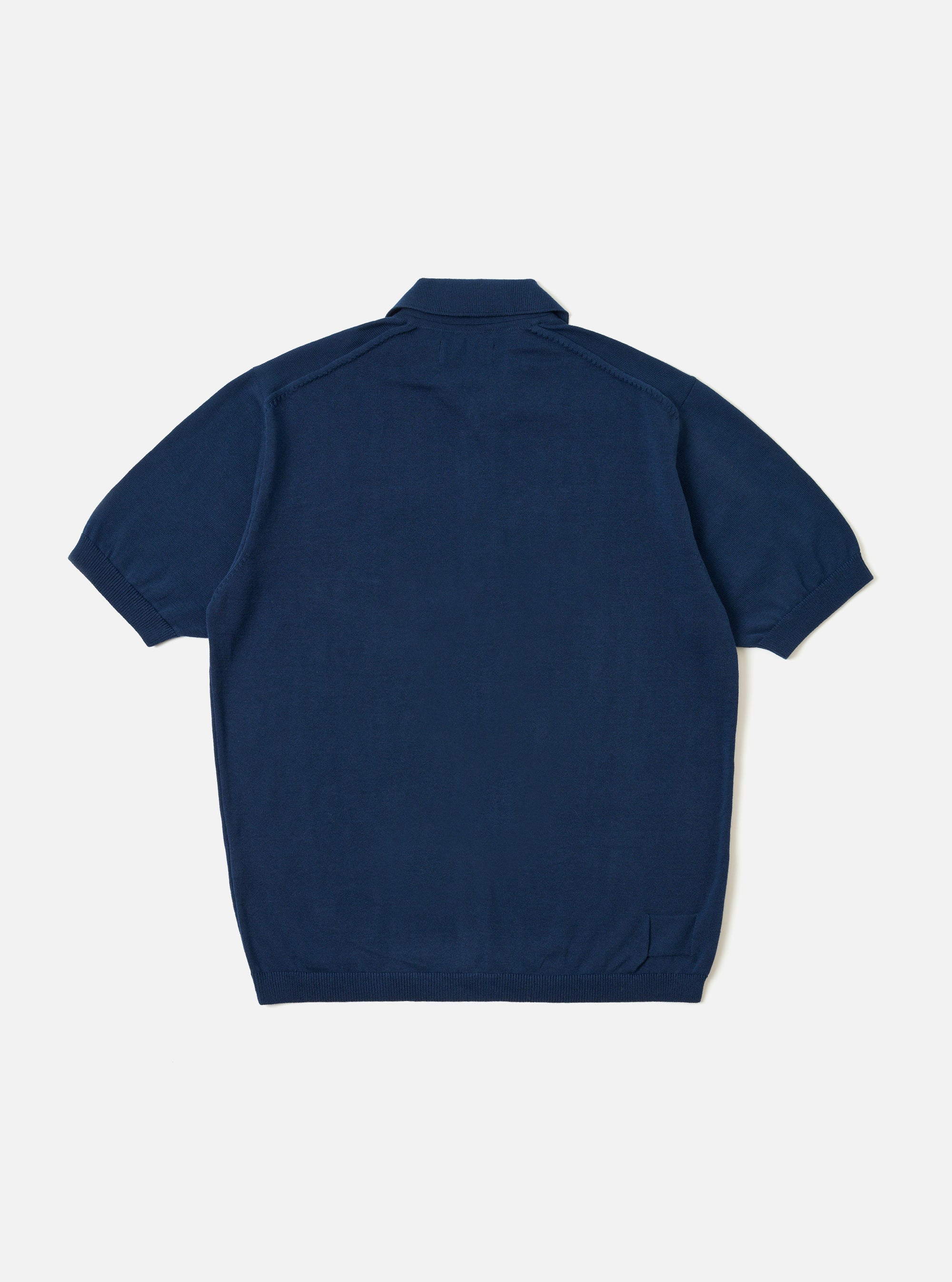 The Dark Navy Cotton Lace Knit Jonny Knit Shirt is shown from the back as a flat lay against a plain white background. The image highlights the all-over openwork square lace pattern of the dark navy cotton knit and the straight hemline.
