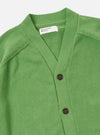 The Green Eco Cotton Knit Pocket David Cardigan is shown from the back as a flat lay against a plain white background. The image highlights the textured knit of the green recycled cotton fabric and the simple, straight-cut construction of the rear panel.