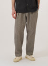 A model wears the Multi Lucas Cotton Mix Oxford Pant against a plain white background. The pants feature a multi-colored check pattern, a wide-leg fit with a slight taper, and a single pleat at the front. The model is shown from the waist down, highlighting the elasticated waistband with a drawstring and the relaxed silhouette of the cotton-mix fabric.