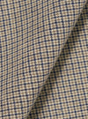 A close-up fabric swatch of the Multi Lucas Cotton Mix Oxford Pant displays a multi-colored check pattern. The image highlights the intricate texture and weave of the cotton, linen, and acrylic blend fabric.