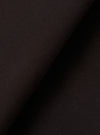 A close-up fabric swatch of the Licorice Summer Canvas Pleated Track Pant highlights the rich licorice brown color and the durable, textured weave of the summer canvas material. The fabric fills the entire frame.