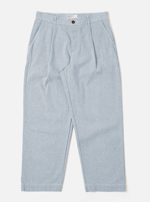 The Light Indigo Jean Cloth Reworked Duke Pant is shown as a flat lay against a plain white background. The trousers feature a wide-leg fit, a single pleat at the front, and a button-front closure with a fixed waistband. The light indigo organic cotton fabric has a textured appearance.