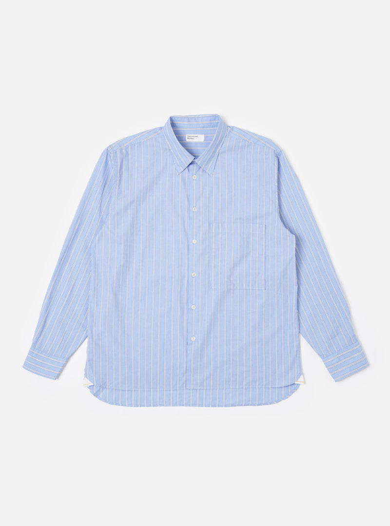 The Blue Mc Stripe Square Pocket Shirt is shown as a flat lay against a plain white background. The shirt features a blue and white pinstripe pattern, a full button-down front, a point collar, and a large, oversized square patch pocket on the left chest. The long sleeves are finished with button cuffs, and the garment has a curved hem.